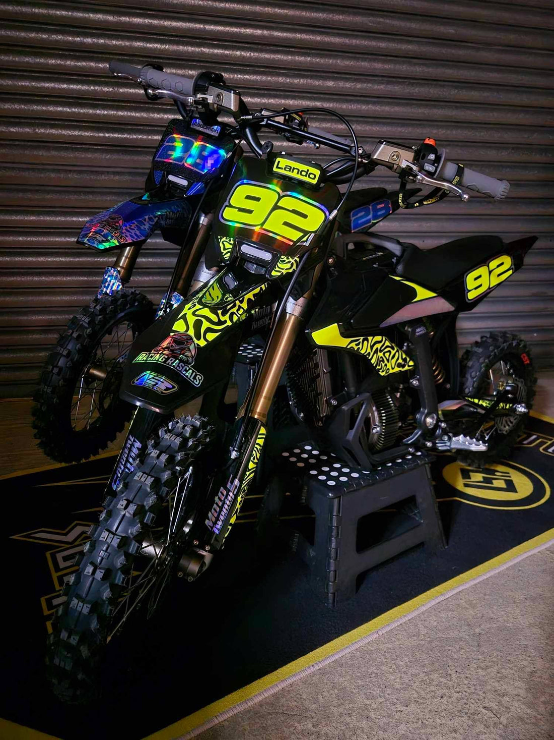 Lando's black and neon yellow Sur-Ron bike with Racing Rascals custom graphics