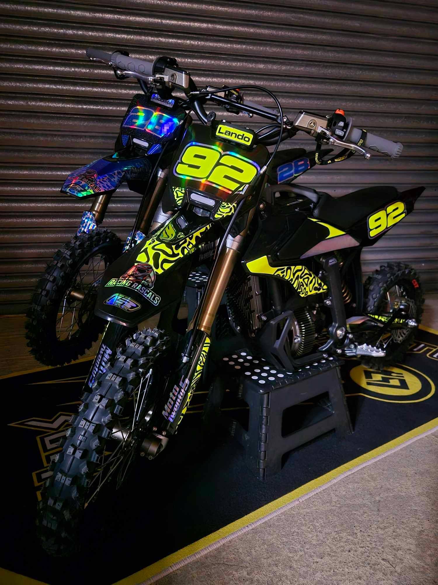 Lando's black and neon yellow Sur-Ron bike with Racing Rascals custom graphics